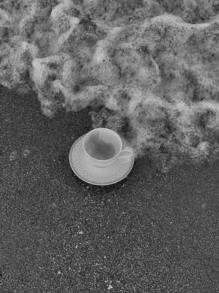 Empty Coffee Cup Left Alone By The Sea